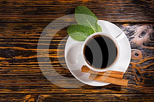 Top down view on tea with leaves and cinnamon