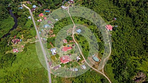 Top-down view of village Mulu surrounded by forest and mountains near Gunung Mulu national park. Borneo. Sarawak.