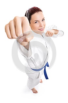 Top down view of a young female fighter in kimono attacking