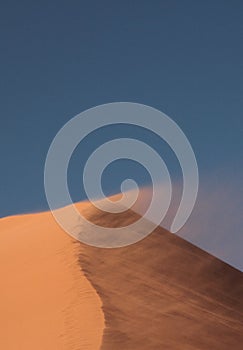 Top of the dune 45 in which the wind lifts the sand