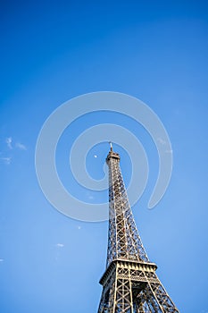 The top of the Eiffel Tower in the sunlight