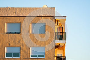 Top floor apartament building in sunset light photo