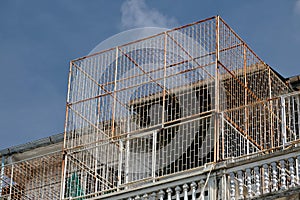 Top floor rusty safety balcony grill