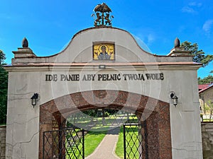 Top of the gate to the Pauline Sanctuary in Lesniow in Poland with the icon of Mary and the coat of arms of the Pauline Order