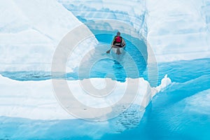 On top of a glacier is a dangerous place to paddle a canoe, but also a beautiful place to see from a new angle photo