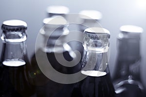 Top of a glass bottle of various soft drinks