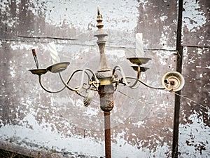 Top half of an old rusty broken floor lamp