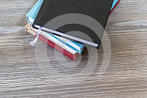 Top high angle above close up view photo Close up top view photo of pile of books on wooden grey table college knowlege literatur