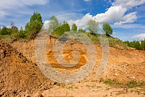 The top layer of earth dug by the excavator bucket for sand mining