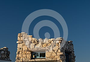 Top Of Lookout Studio Against A Blue Sky Along Grand Canyon