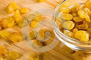 Top macro view of the big raisins in a glass bowl