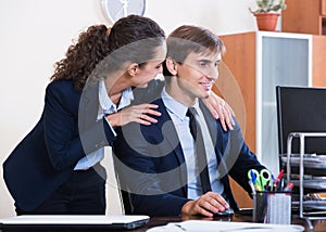 Top manager flirting with subordinate official at workplace