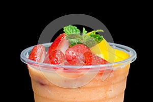 Top of Mango and strawberry smoothies in plastic cup. Refreshmen