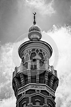 Top of the minaret of the Sunni Mukhtarov Mosque in Vladikavkaz city, North Ossetia Alania, Russia in front of bright
