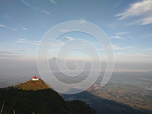 On top of Mount Andong there is a tomb building, you can also see Mount Merbabu and Mount Merapi