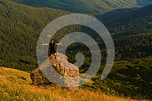 The top of Mount Pip Ivan, a tourist admires the scenery from the top, a hike in the Ukrainian Carpathians, fascinating epic