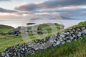 The top of the mountain of Faroe islands. A view of high peaks of mountains on a sunny day. Ocean view.  Beautiful panoramic view.