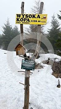 Top of the mountain, memorial sign on the peak in the Polish Mountains. Wysoka Kopa