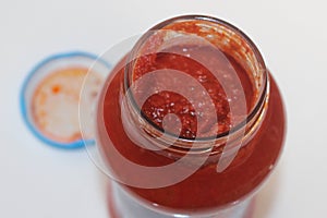 The top of an open jar of tomato pasta sauce