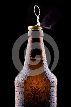 Top of open wet beer bottle