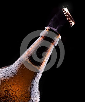 Top of open wet beer bottle