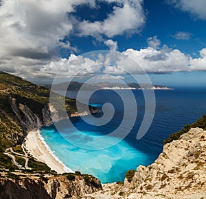 A top panoramic view at Myrtos Beach and fantastic turquoise and blue Ionian Sea water. Aerial view, summer scenery of