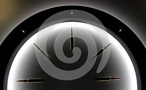 Top part of classic clock dial made of bullets inside a circle of light concept for military watch backgrounds