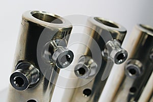 Top part of large diameter electric cable connection tubes with allen key screws, made of stainless steel