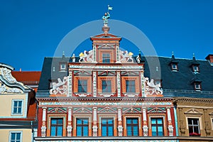 Top part of ornate historical timbered house facade in Erfurt