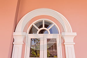 Top part of window on top of door of Chino-Portuguese architectural style photo