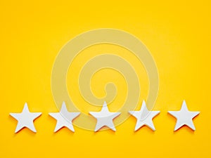 Top position five white stars yellow background