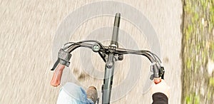 top pov view of man riding electric bike, motion blur