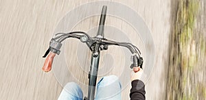 top pov view of man riding electric bike, motion blur