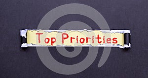 Top Priority text circled in pencil on textured paper