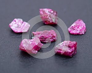 Top quality A grade small rough RUBY crystals from Tanzania on black. RED CORUNDUM.