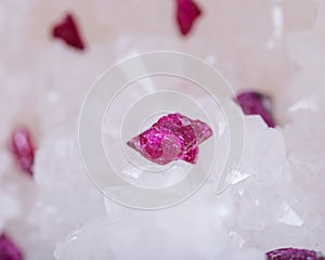 Top quality A grade small rough RUBY crystals from Tanzania on crystalline druzy center of quartz geode. RED CORUNDUM.