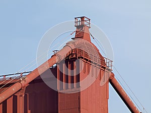 Top of Red Art Deco Tower and supporting cables