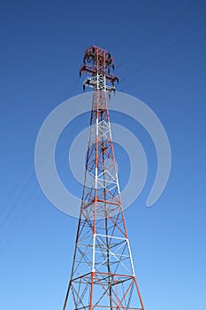 Top of the red and white electricity pylon