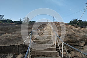 Top of rock hill steps and handrail