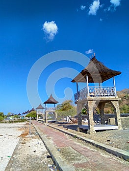 Top roof of huts is traditional sacred house of Timor-Leste in one dollar beach, Metinaro photo