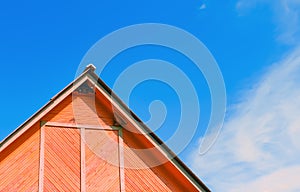 Top Of A Rustic Wooden Building Against The Sky