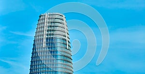 Top of Salesforce Tower on cloudy blue sky day aerial in San Francisco, CA