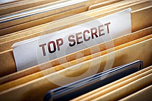 Top secret file folder on background photo