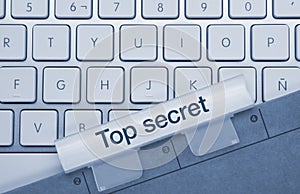 Top secret - Inscription on Blue Keyboard Key photo