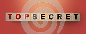 Top Secret words on wooden building cubes blocks. Business, education, Marketing or scandal reveal concept