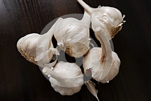 Top shot of garlic`s & cloves on wooden background