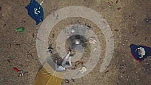 The top shot of a tourist lying in a ward. Beer bottles are scattered everywhere