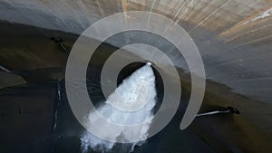 Top shot of water dam, big stream coming out of Presa del Panta de Susqueda, Renewable Energy