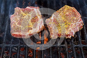 A top sirloin steak flame broiled on a barbecue,