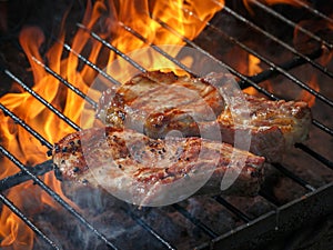 A top sirloin steak flame broiled on a barbecue, shallow depth o photo